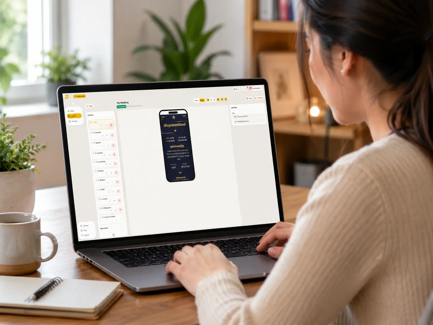 Person at a desk viewing the SendKard builder on a laptop — invitation sections visible with drag handles, a wedding invitation taking shape on screen