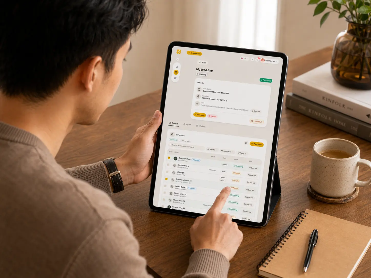 Tablet showing the SendKard RSVP dashboard — a scrolling guest list with attendance status indicators and total confirmed count visible at the top